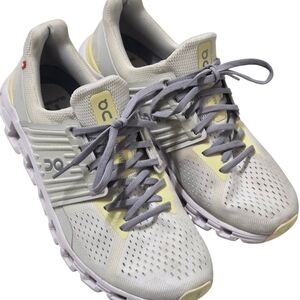 On Running White and Yellow Sneakers